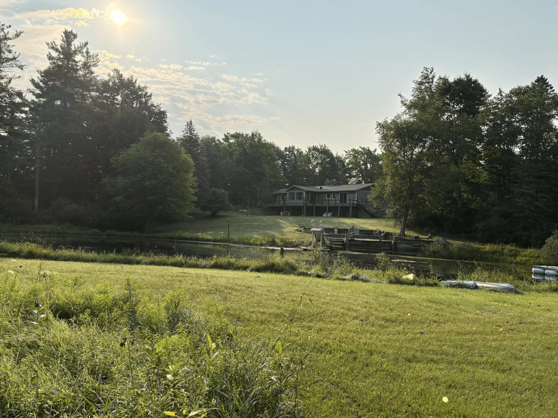 Sunset view across the field toward the house