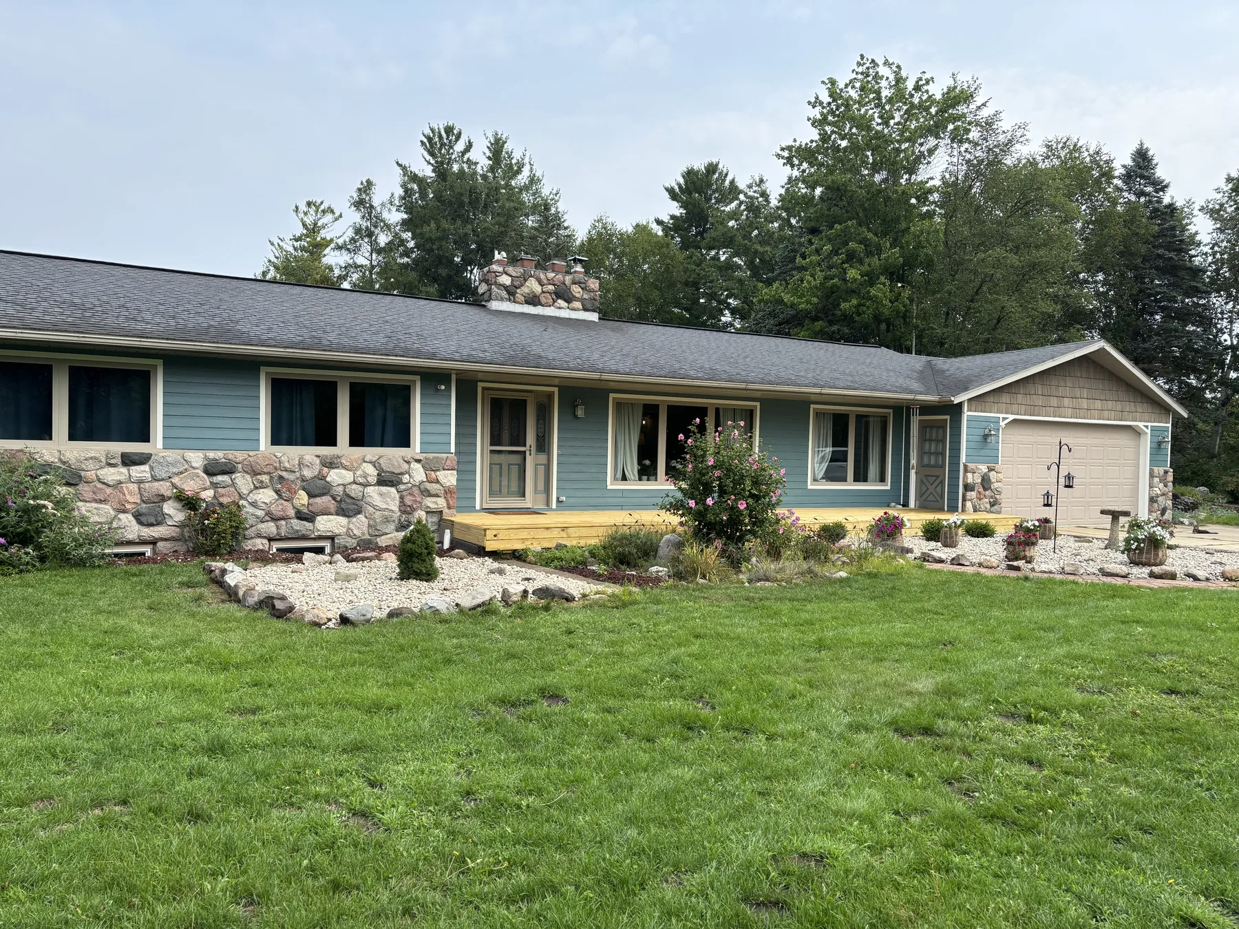Puddle Blue home exterior with new landscaping and lawn
