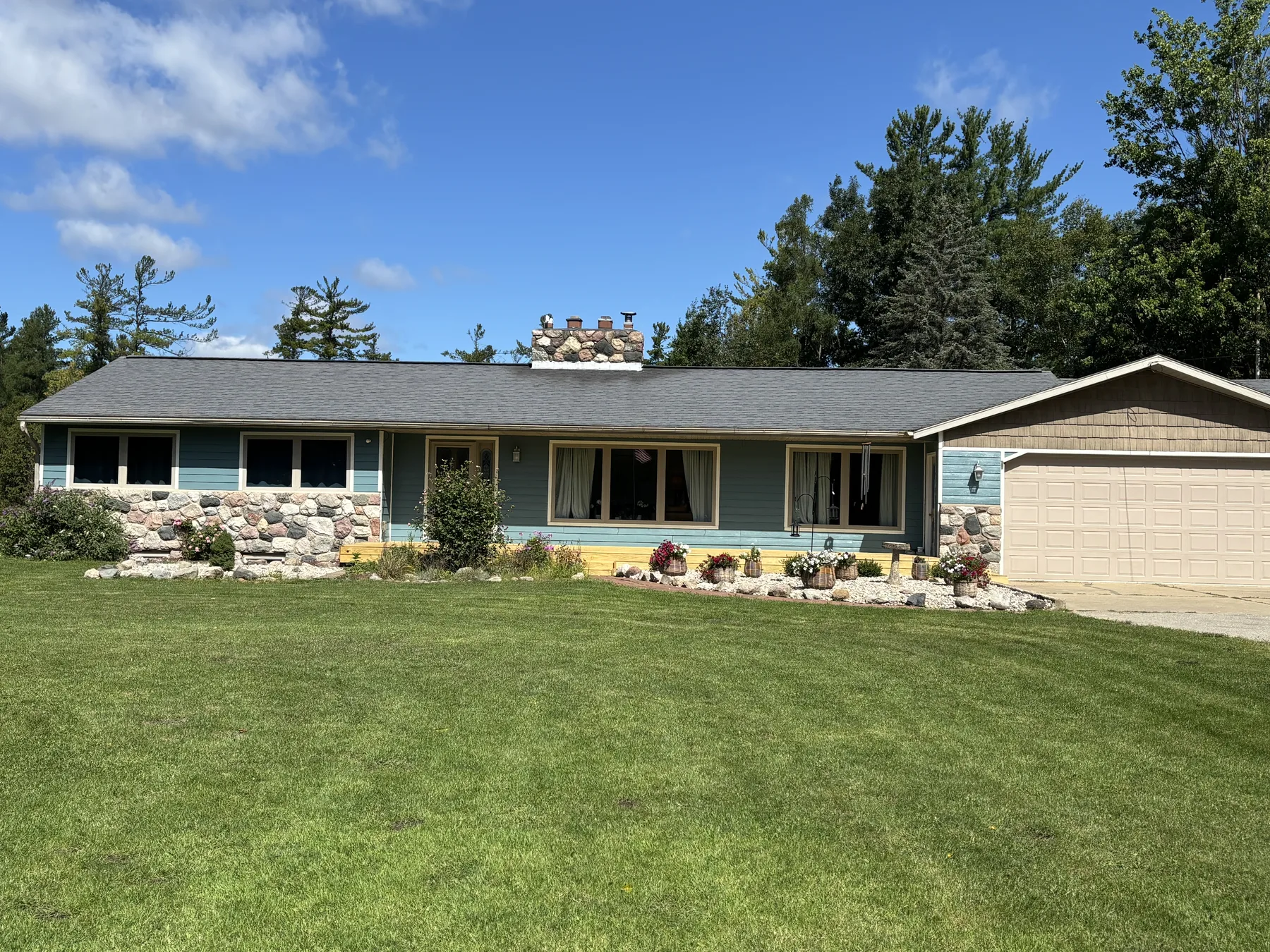 Updated home exterior and broad front lawn